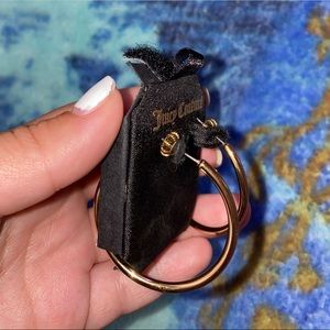 Juicy Couture gold hoop earrings.
